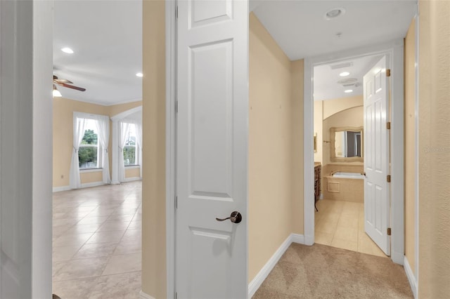 corridor featuring light tile patterned floors