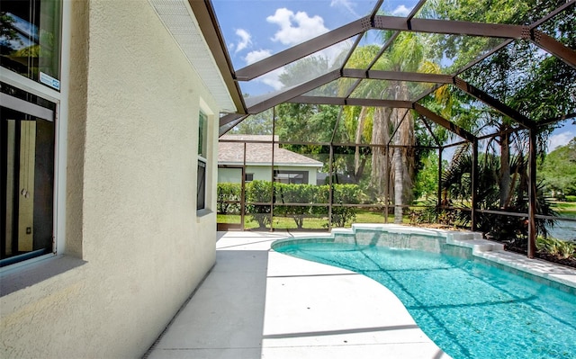 outdoor pool with a lanai and a patio