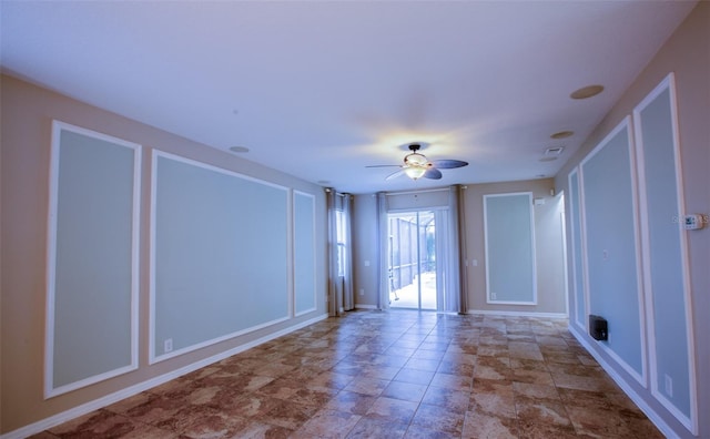 spare room with a ceiling fan