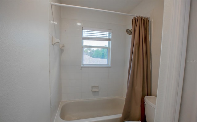 full bath featuring toilet and shower / bathtub combination with curtain