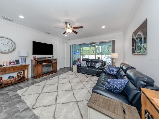 living room with crown molding and ceiling fan