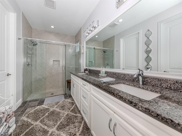 bathroom with vanity and an enclosed shower