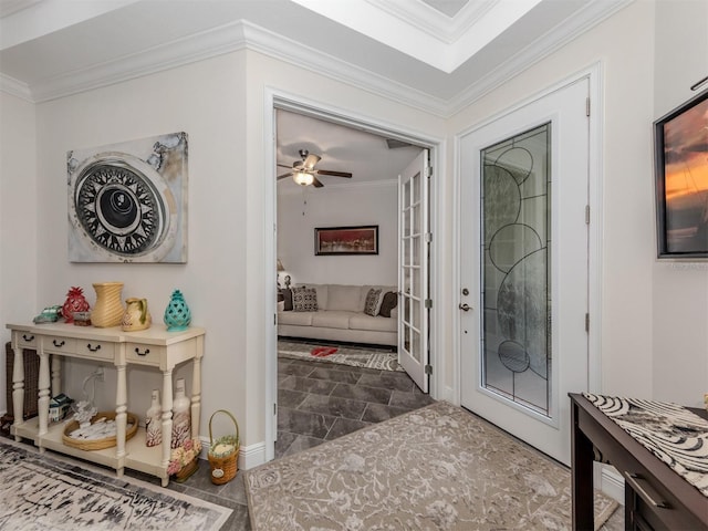 entrance foyer featuring crown molding and ceiling fan