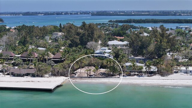 aerial view featuring a water view and a view of the beach