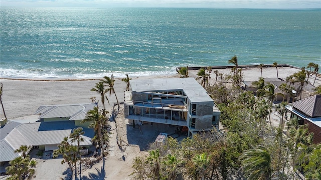 aerial view featuring a water view and a beach view