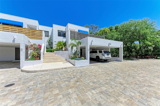 exterior space with a carport