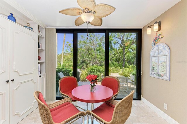 dining space with ceiling fan and built in features