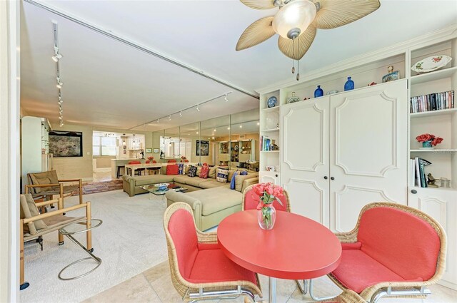 dining area featuring light tile patterned floors and ceiling fan