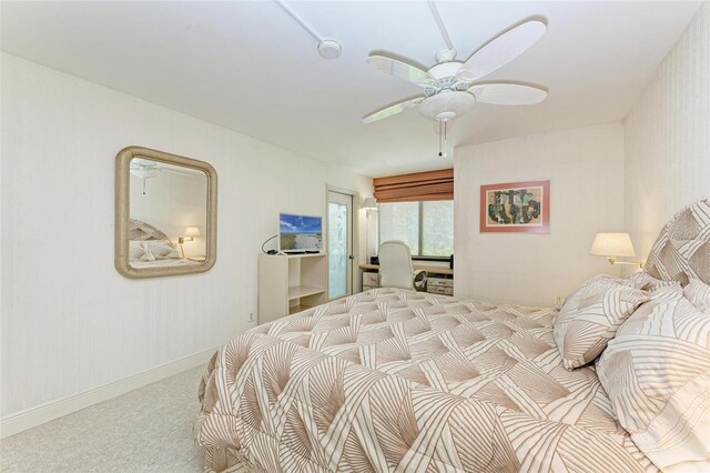 bedroom featuring ceiling fan and light carpet