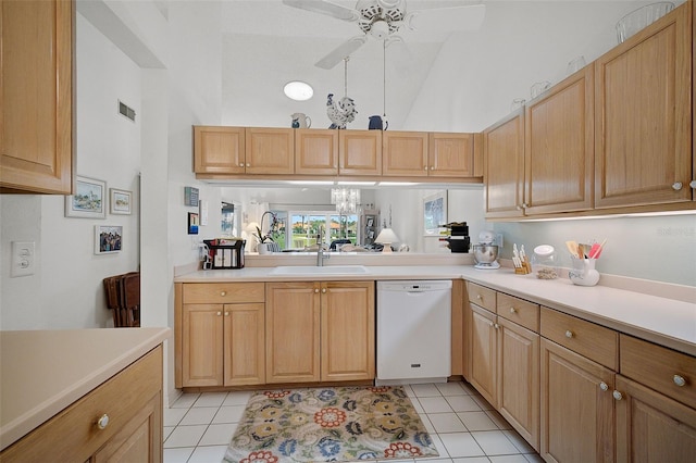 kitchen featuring high vaulted ceiling, sink, white dishwasher, and light tile floors