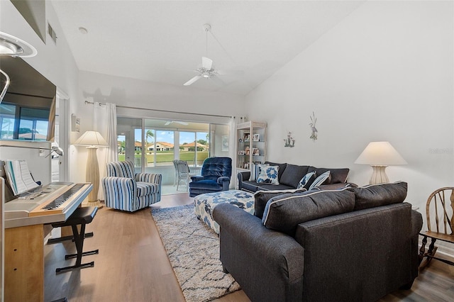 living room featuring high vaulted ceiling, ceiling fan, and hardwood / wood-style flooring