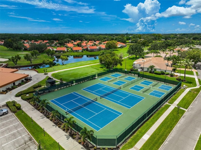 birds eye view of property with a water view