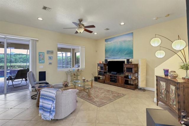 tiled living room with ceiling fan