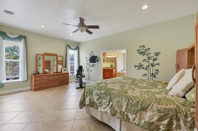 bedroom with connected bathroom, ceiling fan, and light tile flooring