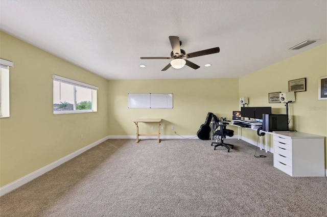 office area featuring light colored carpet and ceiling fan