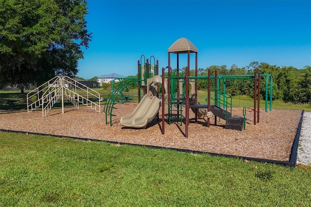 view of play area featuring a lawn