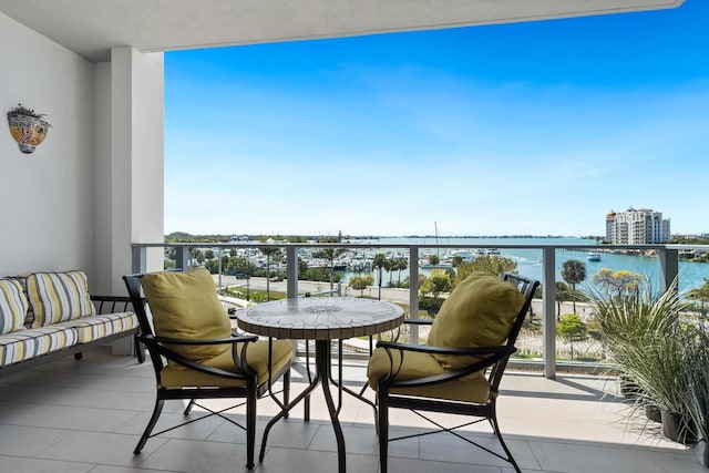 balcony featuring a water view