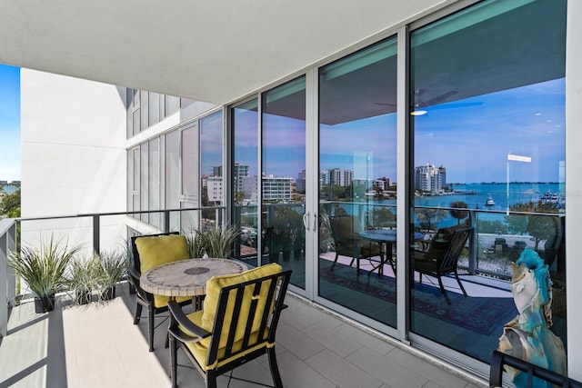 balcony featuring a water view