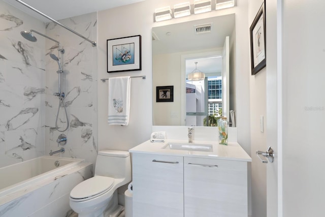 full bathroom featuring vanity, toilet, and tiled shower / bath