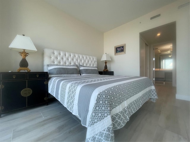 bedroom featuring hardwood / wood-style flooring