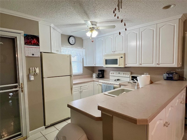 kitchen featuring white cabinets, ceiling fan, light tile flooring, a textured ceiling, and white appliances