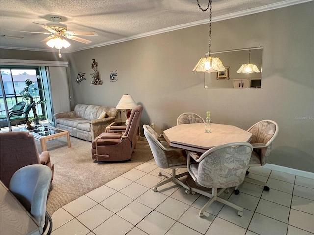 dining room featuring a textured ceiling, light tile floors, and crown molding