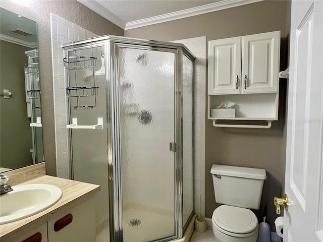 bathroom featuring crown molding, oversized vanity, a shower with shower door, and toilet