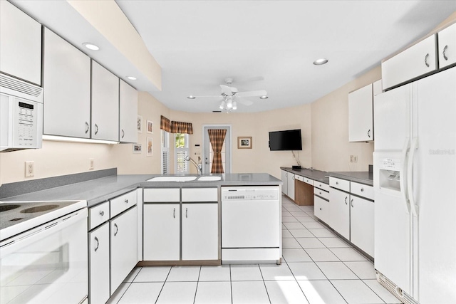 kitchen with white appliances and white cabinetry