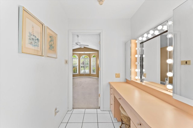 bathroom with lofted ceiling, vanity, ceiling fan, and tile flooring