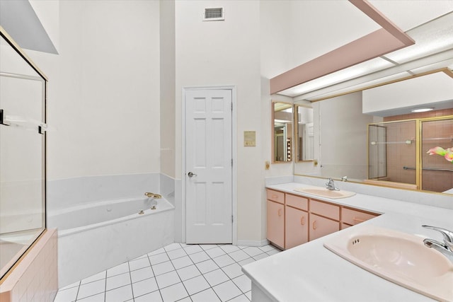 bathroom featuring vanity, tile floors, and separate shower and tub