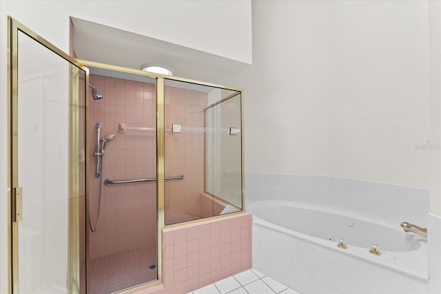 bathroom featuring separate shower and tub and tile floors