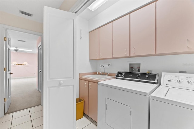 washroom featuring light colored carpet, washing machine and dryer, hookup for a washing machine, sink, and cabinets