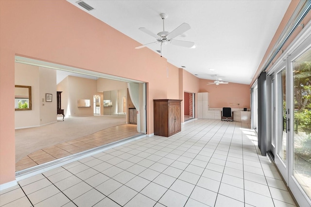 interior space featuring ceiling fan and a high ceiling