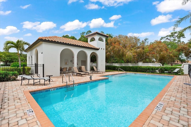 view of pool featuring a patio area