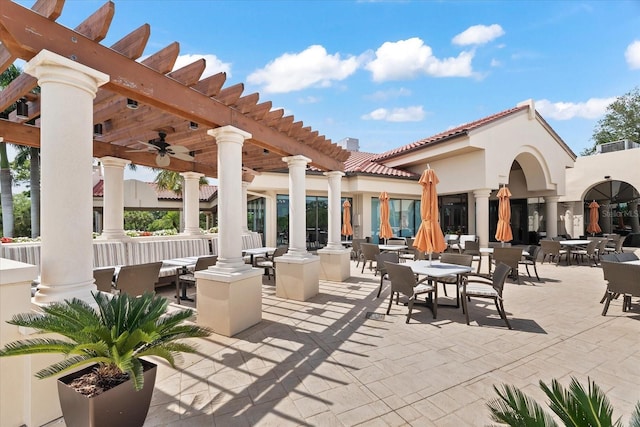 view of terrace with ceiling fan and a pergola