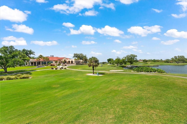 view of home's community featuring a water view and a yard