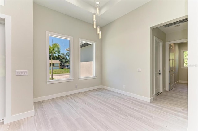 spare room featuring light hardwood / wood-style flooring