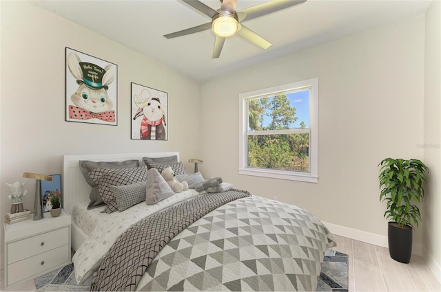 bedroom with ceiling fan and light wood-type flooring