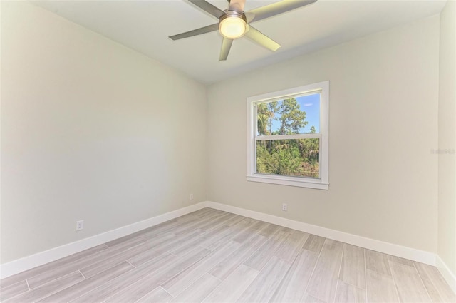 unfurnished room with ceiling fan and light wood-type flooring