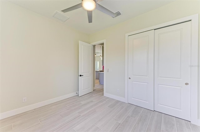 unfurnished bedroom with a closet and ceiling fan