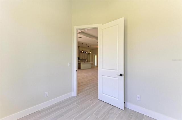 spare room featuring light wood-type flooring