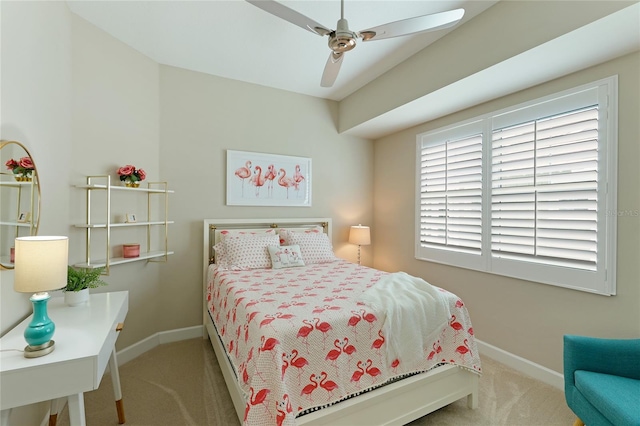 bedroom featuring ceiling fan and light carpet