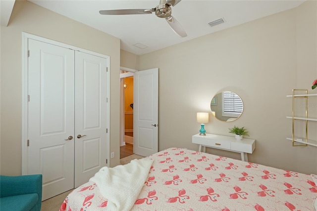 bedroom with ceiling fan and a closet