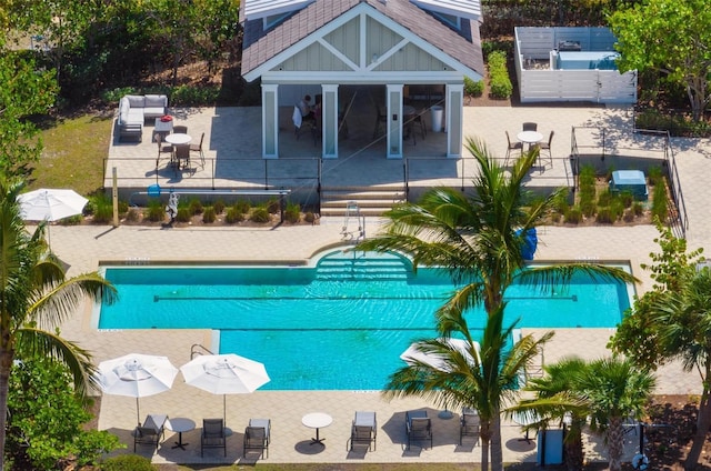 view of swimming pool with a patio