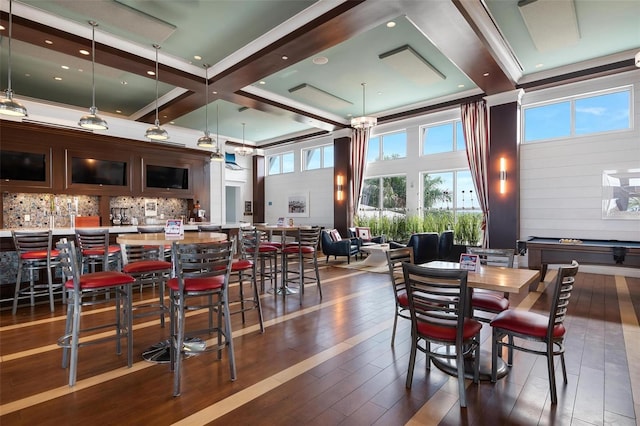 dining room featuring a towering ceiling, coffered ceiling, dark wood-type flooring, beam ceiling, and pool table