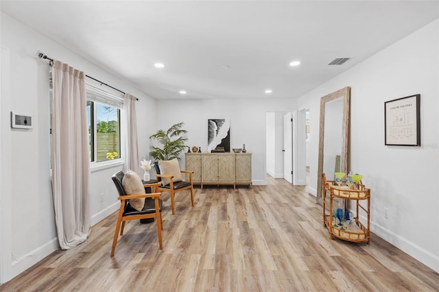 sitting room with light hardwood / wood-style floors