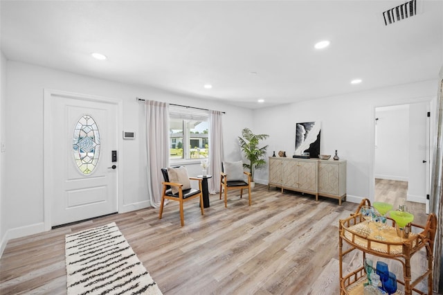 foyer entrance with light wood-type flooring