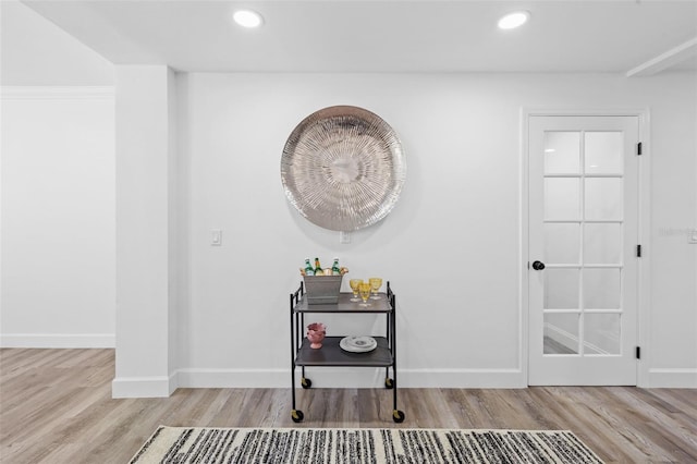 corridor with light hardwood / wood-style flooring