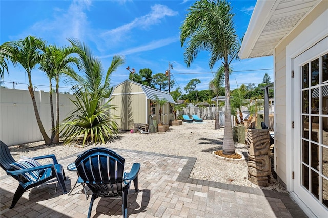 view of patio / terrace featuring a storage shed