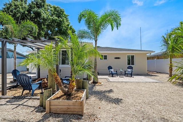 rear view of house with a patio